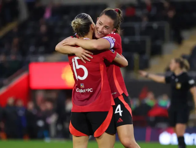 Manchester United's Maya Le Tissier celebrates scoring their second goal against Sunderland with Celin Bizet