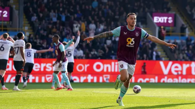 Burnley's Josh Brownhill celebrates with his arms outstretched