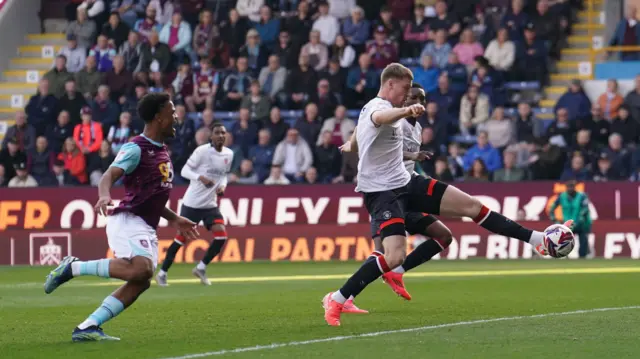 Luton's Mark McGuinness scores an own goal