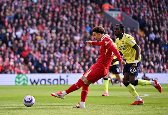 Curtis Jones of Liverpool shoots under pressure