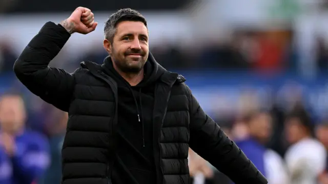 Swansea interim head coach Alan Sheehan celebrates in front of fans