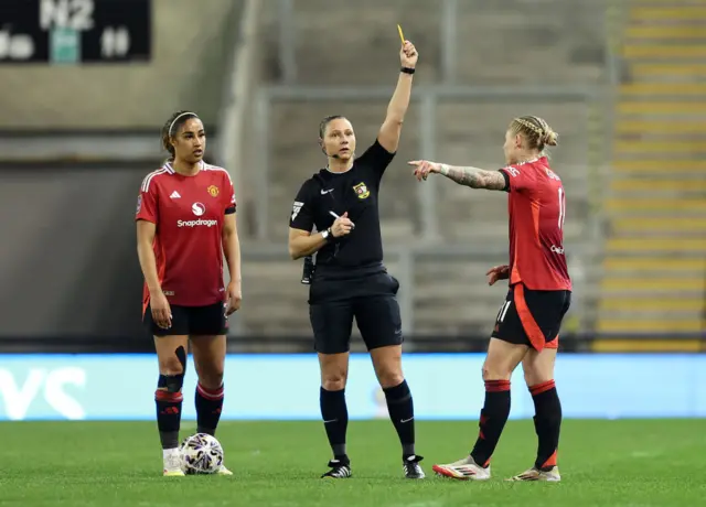 Leah Galton is shown a yellow card