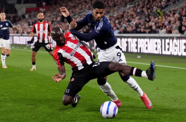 Brentford's Yoane Wissa (left) and Aston Villa's Marcus Rashford battle for the ball