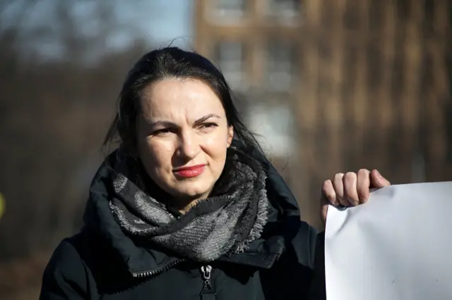 Hanna Hopko is pictured during a rally as demonstrators holding up a piece of paper