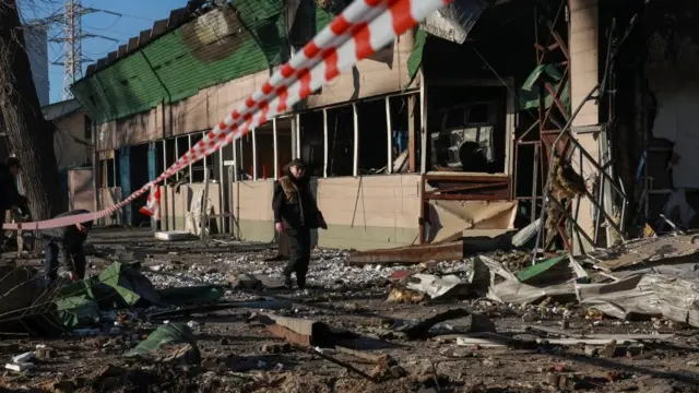 A man walks through the rubble from a strike by Russia on the Ukrainian port city of Odesa.