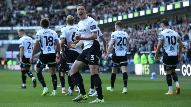 Craig Forsyth celebrates after opening the scoring for Derby against Blackburn