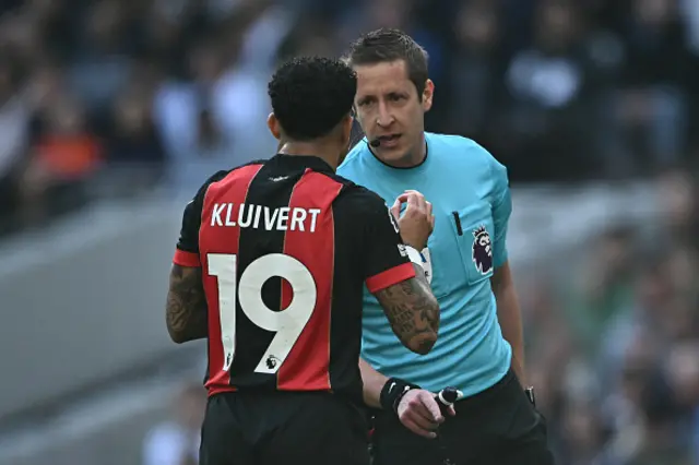 John Brooks speaks with Bournemouth's Dutch striker Justin Kluivert