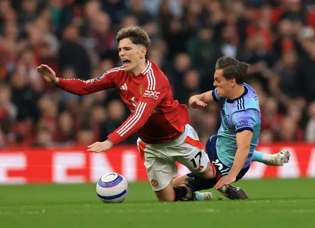 Alejandro Garnacho of Manchester United is fouled by Leandro Trossard