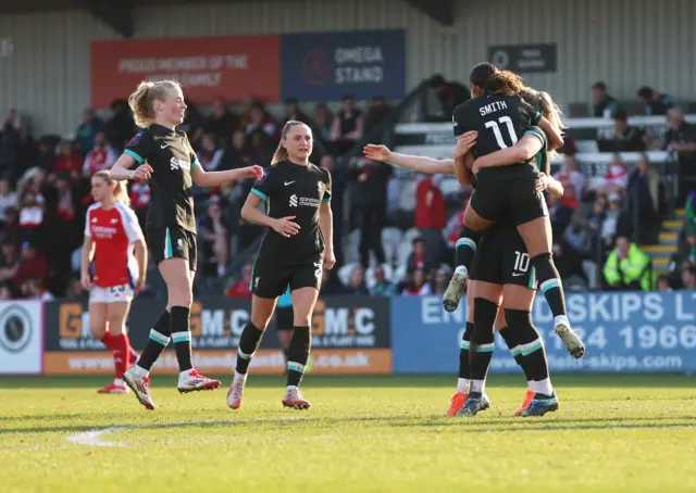 Liverpool celebrate leading Arsenal