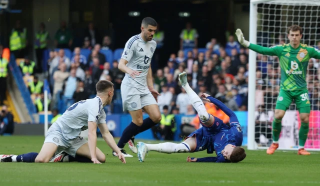 Leicester City's Luke Thomas in action with Chelsea's Cole Palmer