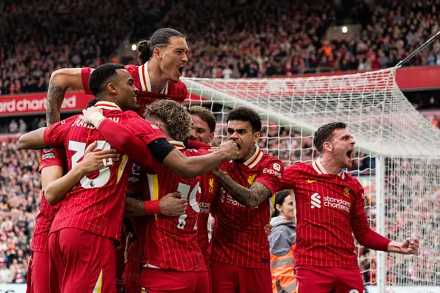 Mohamed Salah celebrates after scoring his first and Liverpool's second goal from the penalty spot