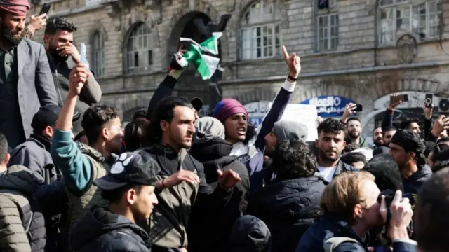 Protestors at Marjeh Square in central Damascus