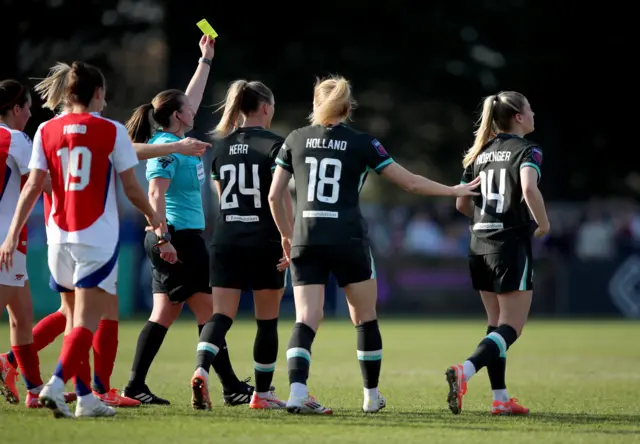 Liverpool's Marie Hobinger is booked during the Adobe Women's FA Cup quarter-final match at Meadow Park, Borehamwood