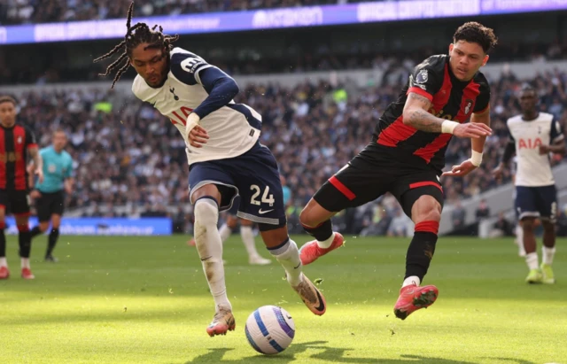 Tottenham Hotspur's Djed Spence in action with AFC Bournemouth's Evanilson