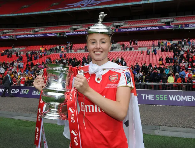 Leah Williamson holds up the FA Cup