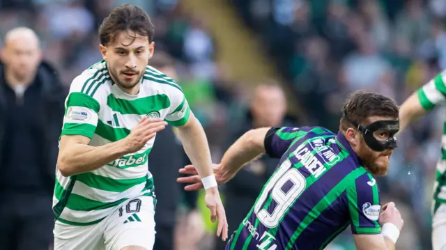 Celtic's Nicolas Kuhn with Hibernian's Nicky Cadden