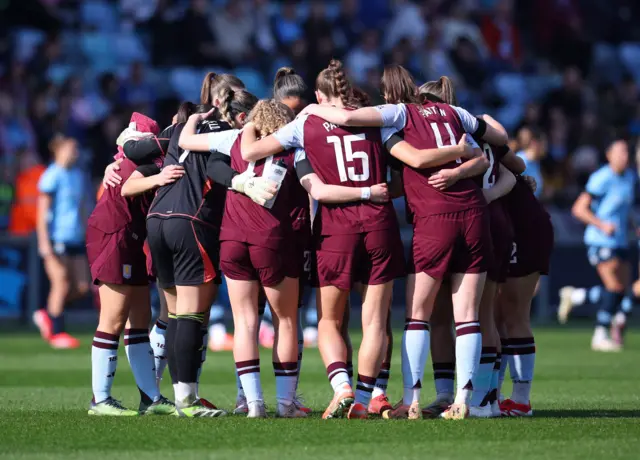 Aston Villa have a team huddle before their game against Manchester City