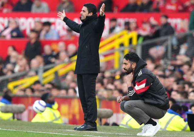 Manchester United manager Ruben Amorim (right) and Arsenal manager Mikel Arteta look on