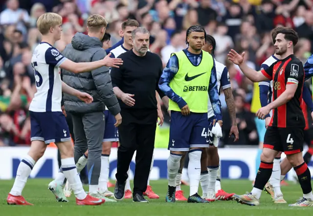 Ange Postecoglou on the pitch alongside players