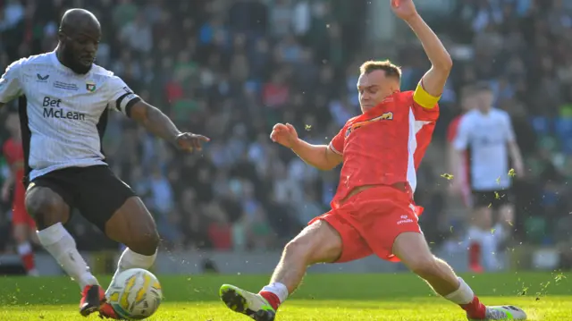 Glens midfielder Fuad Sule is challenged in the Windsor final