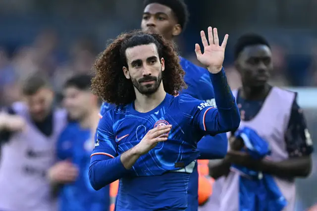 Marc Cucurella applauds the fans