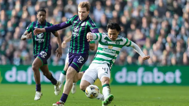 Hibernian's Chris Cadden with Celtic's Reo Hatate