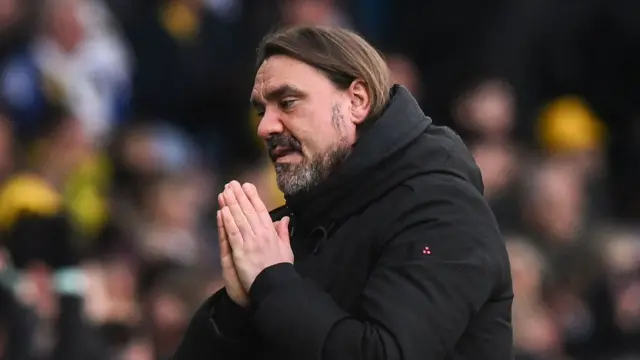 Daniel Farke prays on the touchline