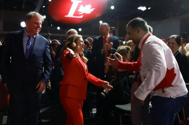 Chrystia Freeland goes to embrace a supporter at the leadership event