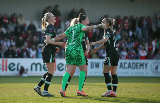 Liverpool players celebrate at full time