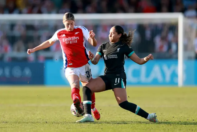 Arsenal's Kyra Cooney-Cross in action with Liverpool's Olivia Smith