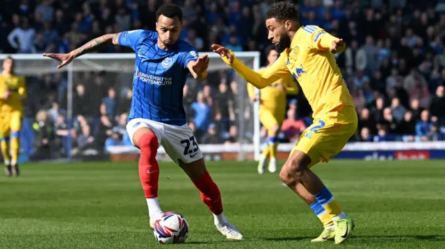 Josh Murphy (23) of Portsmouth on the attack battles for possession with Jayden Bogle (2) of Leeds United during the EFL Championship match between Portsmouth and Leeds United at Fratton Park, Portsmouth