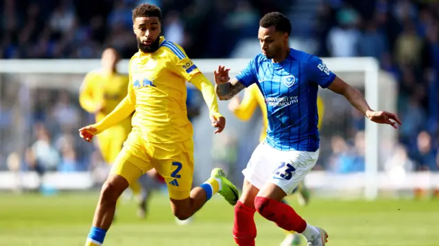 Josh Murphy of Portsmouth and Jayden Bogle of Leeds United