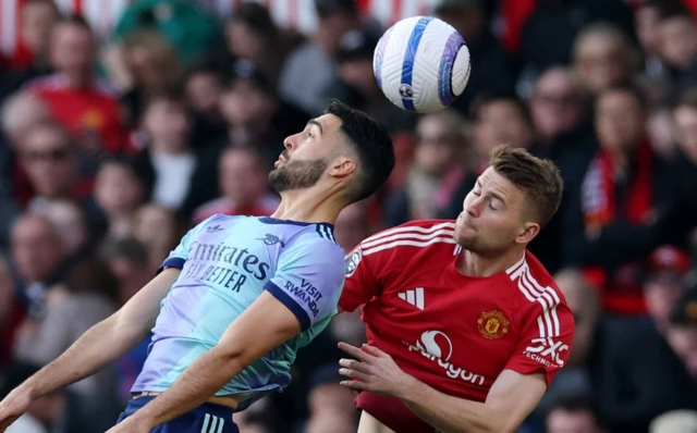 Arsenal's Mikel Merino in action with Manchester United's Matthijs de Ligt