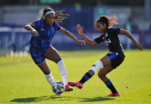 Chelsea's Ashley Lawrence (left) and Crystal Palace's Ashleigh Weerden battle for the ball during the Adobe Women's FA Cup quarter-final match at Kingsmeadow