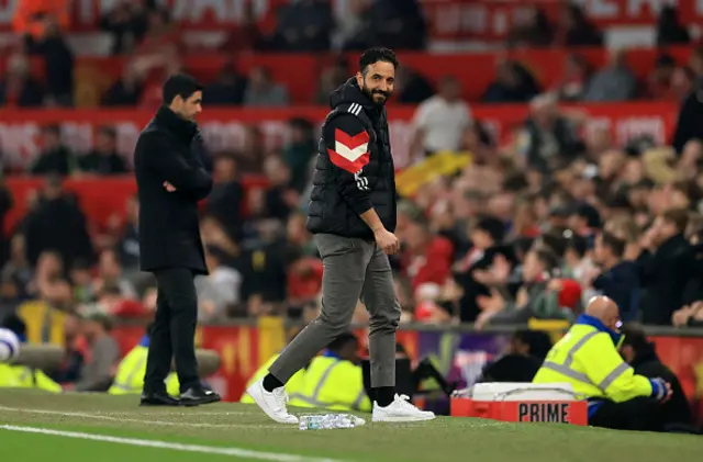 Ruben Amorim smiles on the touchline