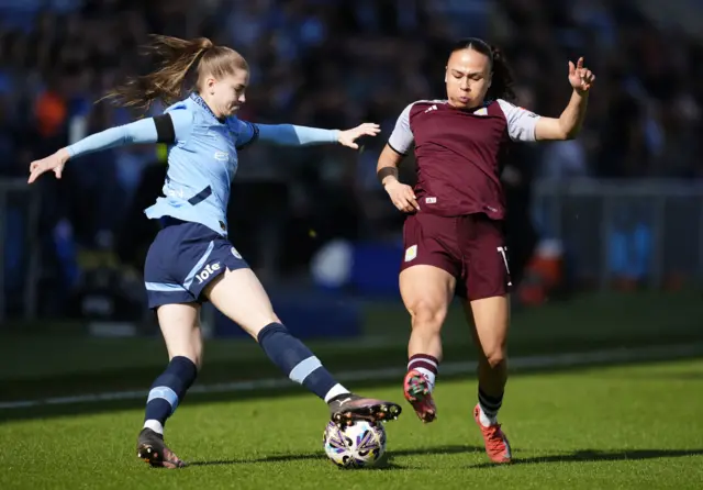 Manchester City's Jess Park (left) and Aston Villa's Ebony Salmon battle for the ball during the Adobe Women's FA Cup quarter-final match at The Joie Stadium, Manchester