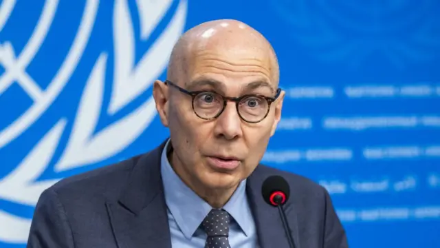 A file photo of UN human rights chief Volker Türk, he is seated and wearing a suit, and is speaking into a microphone