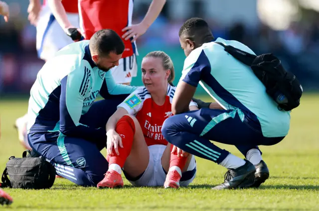 Arsenal's Beth Mead receives medical attention after sustaining an injury