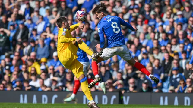 Freddie Potts (8) of Portsmouth is fouled by Joel Piroe (10) of Leeds United