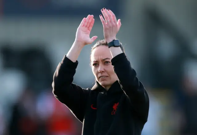 Amber Whiteley claps the fans