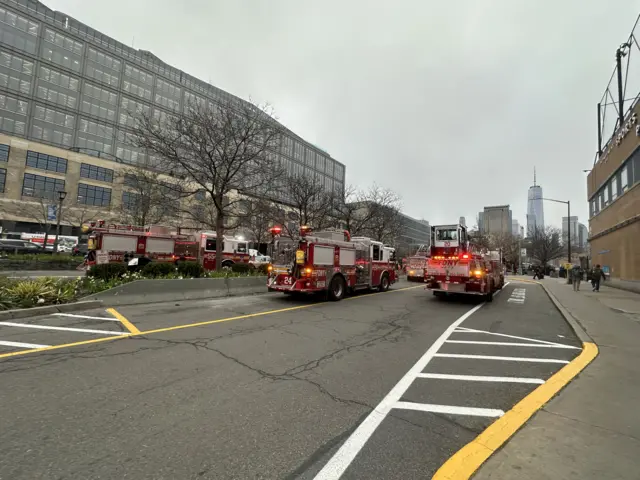 Photo shows fire trucks and crews near the scene of the crash.