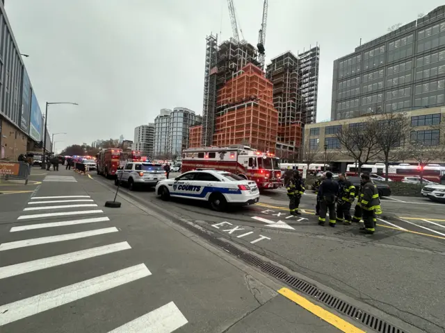 Photo shows police cars, fire trucks and crews near the scene of the crash.