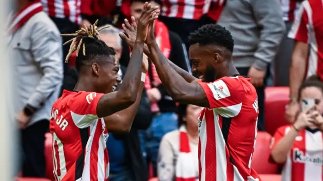 Nico and Inaki Williams celebrate a goal