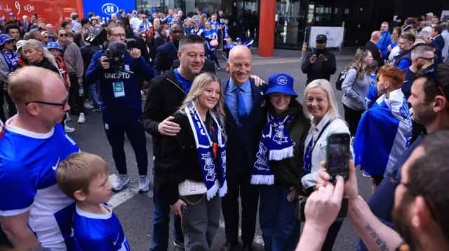 Birmingham owner Tom Wagner having his picture taken with supporters
