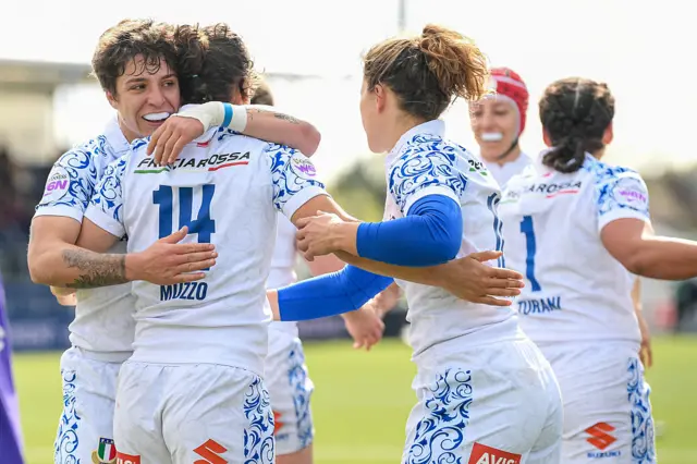 Aura Muzzo celebrating her try with team meats