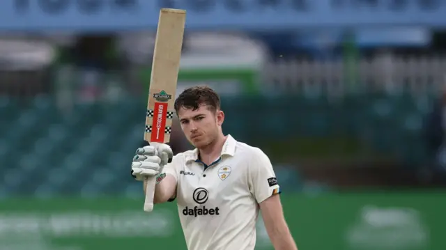 Martin Andersson celebrates his 100