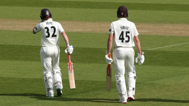 Ollie Pope and Dom Sibley head out to the middle