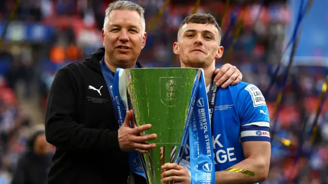 Darren Ferguson and Harrison Burrows with trophy