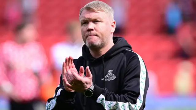 Doncaster boss Grant McCann applauding supporters