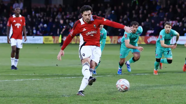 Cole Stockton taking a penalty for Salford City